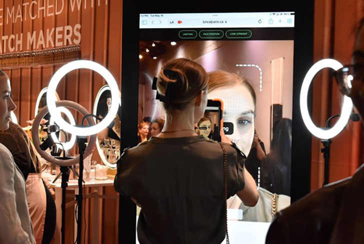 A woman engages with an AR experience built for L’Oreal’s True Match Foundation