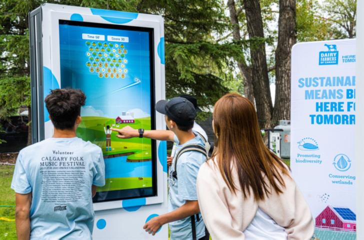 A gamification station deployed at folk festivals to raise awareness about Dairy Farmers
