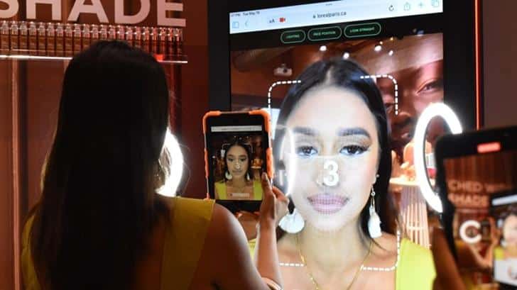 A woman uses Augmented Reality in a retail environment
